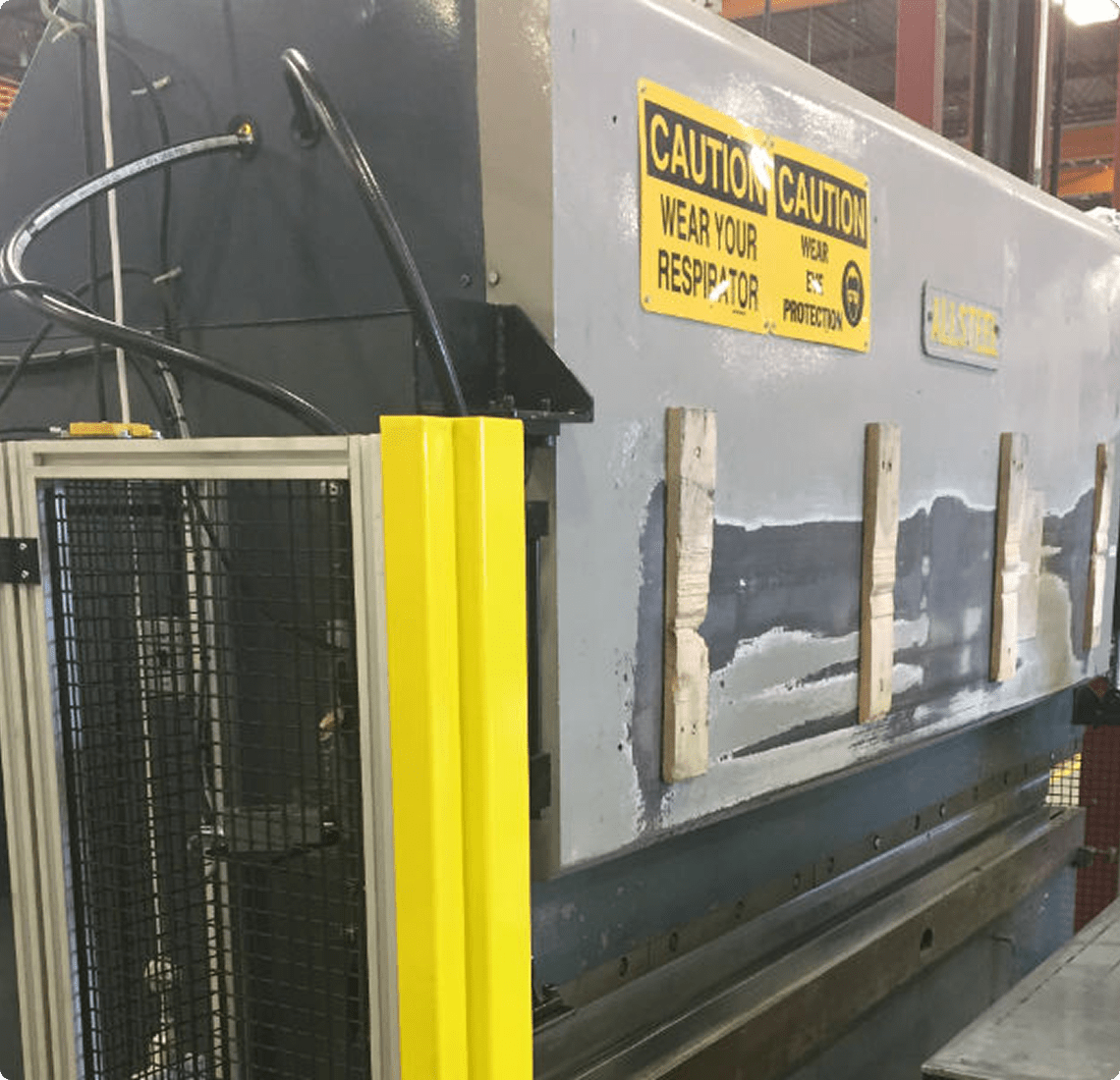 Industrial machinery with caution signs