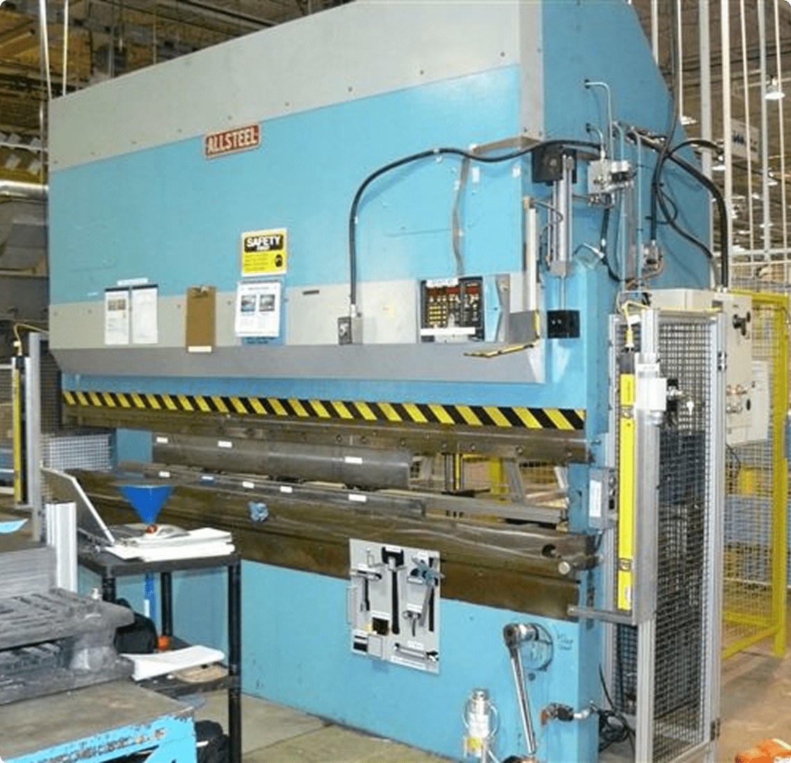 Large blue metalworking machine in workshop