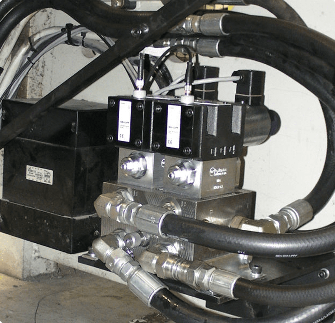 Machinery components featuring hydraulic connections.